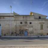 Si tratta della facciata dell�antica masseria, al centro della quale � incastonato il prospetto neoclassico della chiesa della Santissima Trinit�